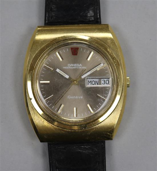 A gentlemans gold plated and steel Omega megaquartz wrist watch.